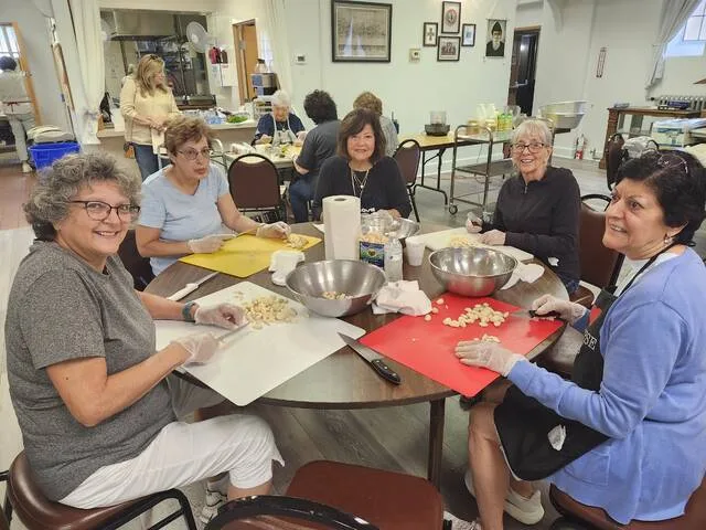 theweekender.com - The Weekender - Volunteers prepare ethnic delicacies for Lebanese Food Festival
